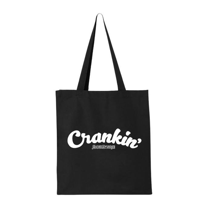 A black canvas tote bag with long shoulder straps, with 'Crankin'' printed in white script on the front, with a smaller 'SoulBounce' logo printed in white underneath, shown on a plain white background.
